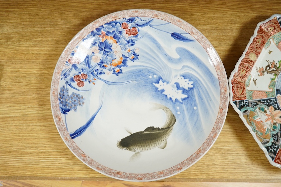 Two Japanese Imari style dishes, both Meiji period, one by Fukagawa decorated with a leaping carp, mountain mark to the base, largest 46cm in diameter. Condition - good